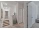 Second floor hallway featuring carpeted floors, neutral walls, and access to multiple rooms at 4316 Sailplane Ct, Wesley Chapel, FL 33545