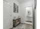Entryway and hallway lead to powder room with pedestal sink at 4316 Sailplane Ct, Wesley Chapel, FL 33545