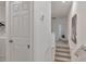 Bright hallway leading to laundry room with washer and dryer at 4316 Sailplane Ct, Wesley Chapel, FL 33545