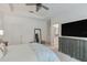 Spacious carpeted main bedroom with ensuite bathroom and large dresser with TV at 4316 Sailplane Ct, Wesley Chapel, FL 33545