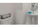 Powder room features a white toilet and a pedestal sink with mirror at 4316 Sailplane Ct, Wesley Chapel, FL 33545