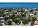 Stunning aerial view of the neighborhood featuring waterfront homes with backyard pools and lush tree coverage at 444 W Davis Blvd, Tampa, FL 33606