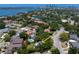 Panoramic aerial view of a neighborhood with mature trees, nearby bodies of water, and city skyline at 444 W Davis Blvd, Tampa, FL 33606