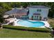 Backyard showcasing a lovely in-ground pool, patio dining set and lounge chairs at 444 W Davis Blvd, Tampa, FL 33606