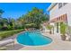 Beautiful backyard featuring a large swimming pool, lounge chairs, and manicured landscaping at 444 W Davis Blvd, Tampa, FL 33606