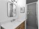 Elegant bathroom featuring a modern vanity, mirror, and glass shower at 444 W Davis Blvd, Tampa, FL 33606