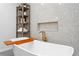 Luxurious bathroom with a soaking tub and sleek shelving at 444 W Davis Blvd, Tampa, FL 33606