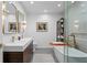 Beautiful bathroom with dual sinks, modern tub, and stylish fixtures at 444 W Davis Blvd, Tampa, FL 33606