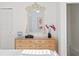 Bedroom dresser with tropical themed mirror, decorations, and white walls at 444 W Davis Blvd, Tampa, FL 33606