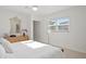 Bedroom with a white color palette, a window with blinds, and minimal decoration at 444 W Davis Blvd, Tampa, FL 33606