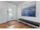 Elegant entryway featuring a decorative glass door, modern art, and comfortable seating at 444 W Davis Blvd, Tampa, FL 33606