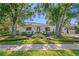 Charming single-story home with well-manicured landscaping and mature shade trees at 444 W Davis Blvd, Tampa, FL 33606