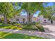 Charming home featuring a well-manicured lawn, lush landscaping, and a serene setting at 444 W Davis Blvd, Tampa, FL 33606