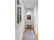 Bright hallway featuring hardwood floors, recessed lighting, and stylish art at 444 W Davis Blvd, Tampa, FL 33606