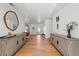 Well-lit hallway featuring hardwood floors, modern furnishings, and stylish decor at 444 W Davis Blvd, Tampa, FL 33606