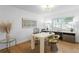 Bright home office featuring hardwood floors, modern desk, and natural light at 444 W Davis Blvd, Tampa, FL 33606