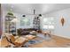 Bright living room featuring modern furniture, natural light, and hardwood floors at 444 W Davis Blvd, Tampa, FL 33606
