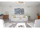 Inviting living room with comfortable white seating, modern art, and plenty of natural light at 444 W Davis Blvd, Tampa, FL 33606
