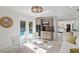 Charming living area with a mini kitchen, pool view, and modern furniture at 444 W Davis Blvd, Tampa, FL 33606