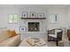 Bright living room features a white brick fireplace, modern furniture, and natural light at 444 W Davis Blvd, Tampa, FL 33606