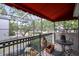 View from an outdoor balcony of the street with seating, awning and a wrought iron railing at 4941 Bayshore Blvd, Tampa, FL 33611