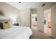 Bedroom with neutral decor, carpet, an overhead fan, double closets, and an attached bathroom at 4941 Bayshore Blvd, Tampa, FL 33611