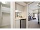 Bedroom featuring a mini bar area with a mini-fridge and walk-in closet at 4941 Bayshore Blvd, Tampa, FL 33611