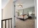 Spacious main bedroom with a four-poster bed, fan, and balcony access at 4941 Bayshore Blvd, Tampa, FL 33611