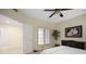 Well-lit bedroom with neutral tones, carpet, an overhead fan, and a view to other rooms at 4941 Bayshore Blvd, Tampa, FL 33611