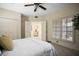 Bright bedroom with double closets, neutral tones, and an open doorway to the sitting room at 4941 Bayshore Blvd, Tampa, FL 33611