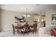 Dining room with an elegant chandelier and view to the living room at 4941 Bayshore Blvd, Tampa, FL 33611
