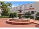 Exterior shot of a beautiful multi-tiered water fountain surrounded by lush tropical landscaping at 4941 Bayshore Blvd, Tampa, FL 33611