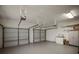 Spacious and clean three-car garage with ample storage shelving and lighting at 4941 Bayshore Blvd, Tampa, FL 33611