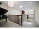 Upstairs hallway with railing, piano, skylight and ceiling fan at 4941 Bayshore Blvd, Tampa, FL 33611