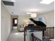 Bright hallway featuring a piano, skylight, and neutral paint at 4941 Bayshore Blvd, Tampa, FL 33611
