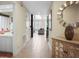 Bright hallway featuring tile flooring, a decorative mirror, and a glimpse into the living room at 4941 Bayshore Blvd, Tampa, FL 33611