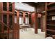 Expansive home office with custom wood bookshelves and detailed woodwork, and access to additional storage at 4941 Bayshore Blvd, Tampa, FL 33611