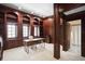 Elegant home office with custom wood bookshelves, trim, and an attractive modern desk at 4941 Bayshore Blvd, Tampa, FL 33611