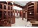 Extensive home office area features a large workspace, custom bookcases, and detailed woodwork at 4941 Bayshore Blvd, Tampa, FL 33611