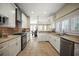 Spacious kitchen with white cabinets, stainless steel appliances, tile floors, and mosaic tile backsplash at 4941 Bayshore Blvd, Tampa, FL 33611