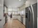Bright kitchen with white cabinets, stainless steel appliances, and a view of the dining area at 4941 Bayshore Blvd, Tampa, FL 33611