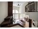 Bright living room featuring a soaring ceiling, fireplace with custom built-ins, and backyard views at 4941 Bayshore Blvd, Tampa, FL 33611