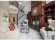 Cozy living room with a fireplace, custom built-ins, and staircase access at 4941 Bayshore Blvd, Tampa, FL 33611
