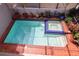 Top view of the brick-lined pool with elevated jacuzzi and unique tile details at 4941 Bayshore Blvd, Tampa, FL 33611