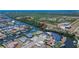 Aerial view of waterfront property showcasing canal access and neighborhood layout at 6530 Manila Palm Way, Apollo Beach, FL 33572