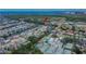 An aerial view of a waterfront community featuring canal access, tennis courts and a community pool at 6530 Manila Palm Way, Apollo Beach, FL 33572