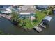 Waterfront house boasts an updated pool, dock, and landscaping at 6530 Manila Palm Way, Apollo Beach, FL 33572