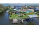 Waterfront home featuring a private pool, dock, and boat lift with scenic neighborhood views at 6530 Manila Palm Way, Apollo Beach, FL 33572
