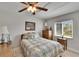 Bright bedroom features a ceiling fan and window, offering a comfortable and well-lit space at 6530 Manila Palm Way, Apollo Beach, FL 33572