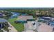 A charming waterfront home with well-maintained landscaping and a boat in the driveway at 6530 Manila Palm Way, Apollo Beach, FL 33572